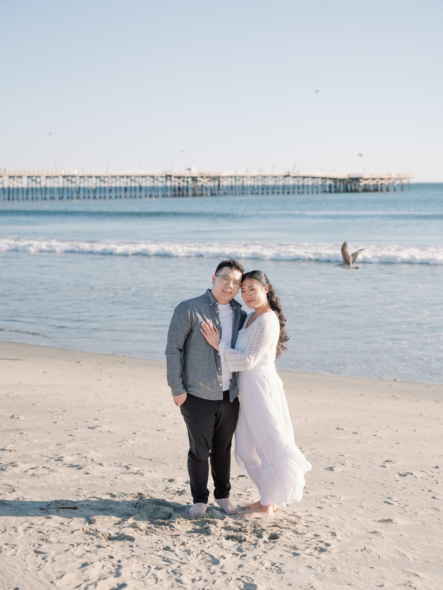 Christine and Thomas on the beach near the pier.