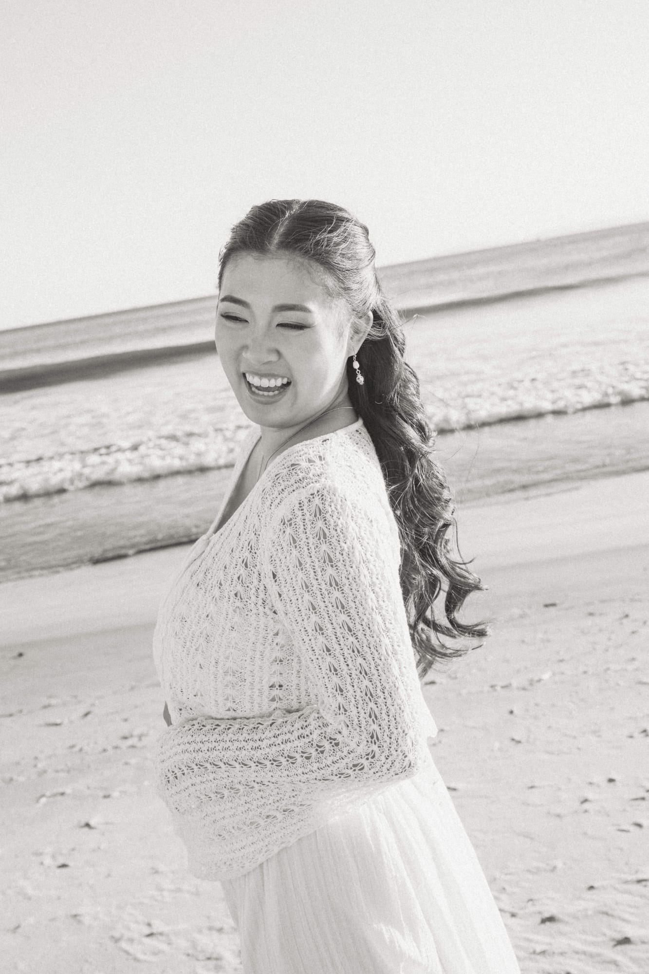 Christine laughing on the beach.