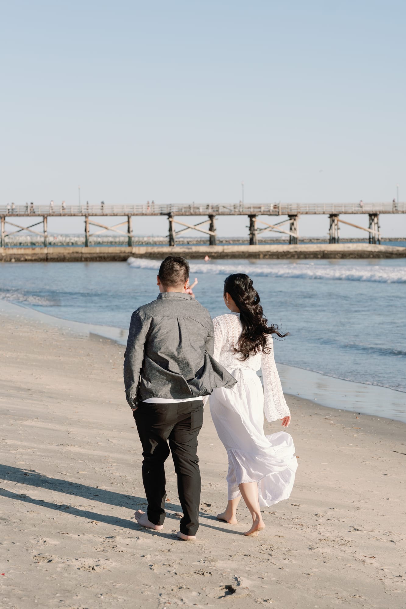 Christine and Thomas walking toward the pier.